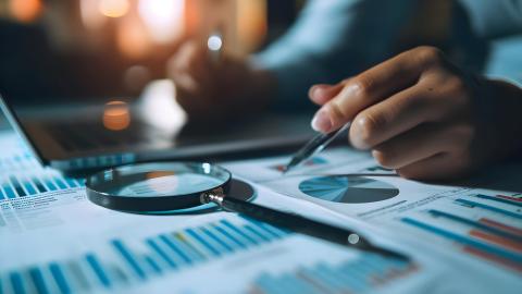 charts and magnifying glass