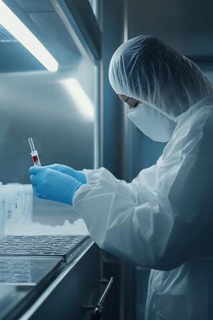 Lab worker performing an experiment.